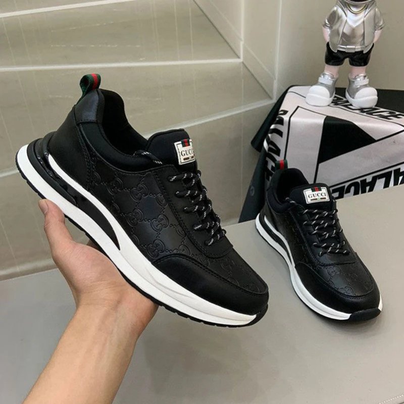 Gucci Black Leather Sneakers with GG Pattern and White Sole