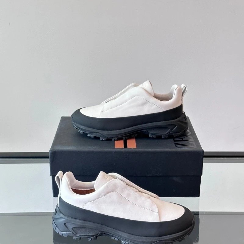 TOD'S White Slip-On Sneakers with Black Rubber Sole