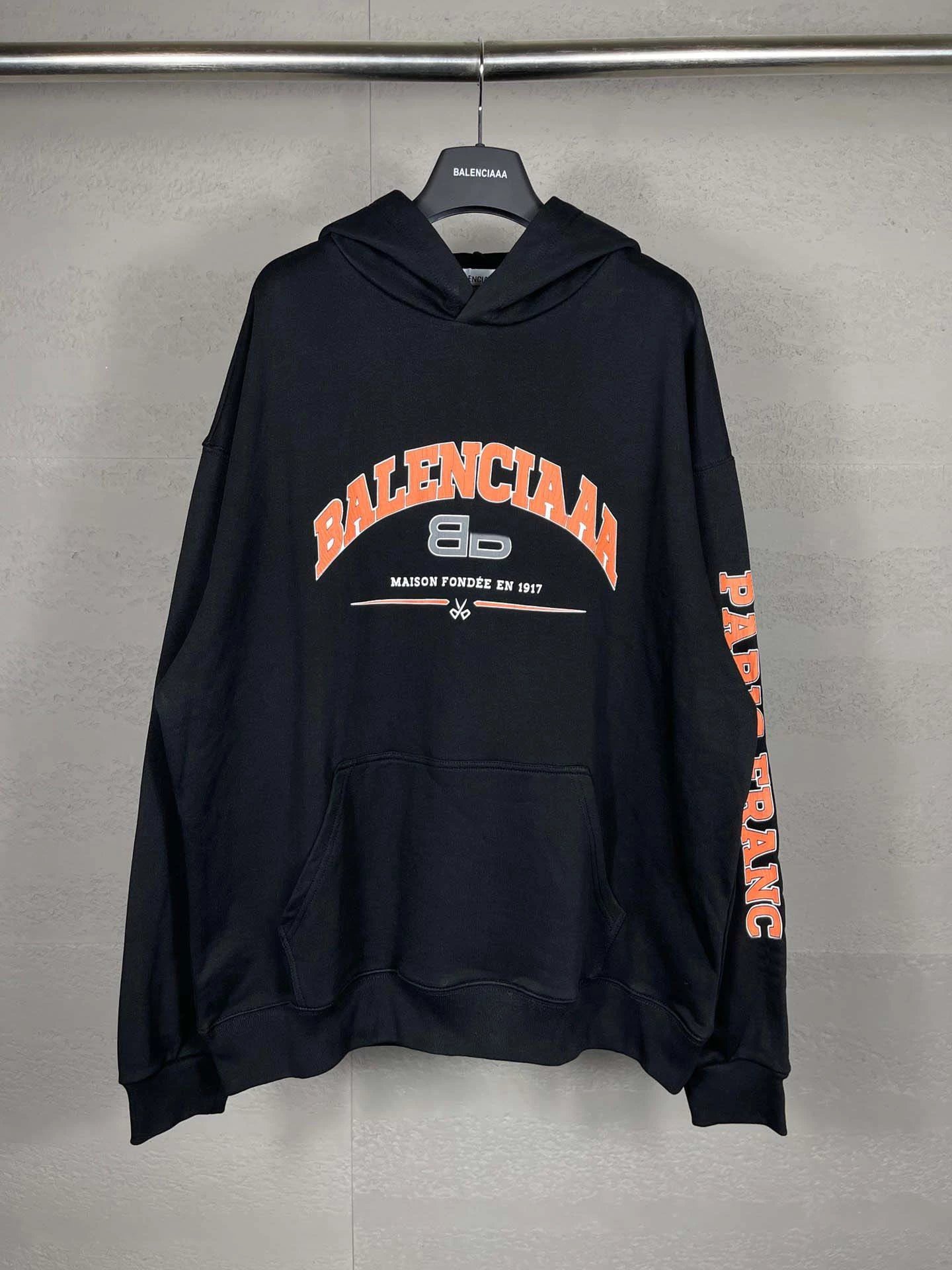 Balenciaga Black Hoodie with Orange Logo and Sleeve Print