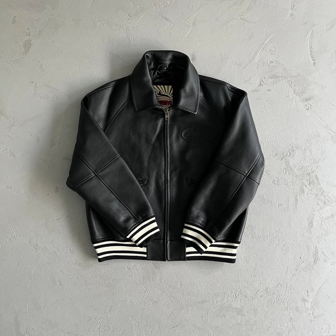 Black Leather Bomber Jacket with Striped Cuffs and Hem