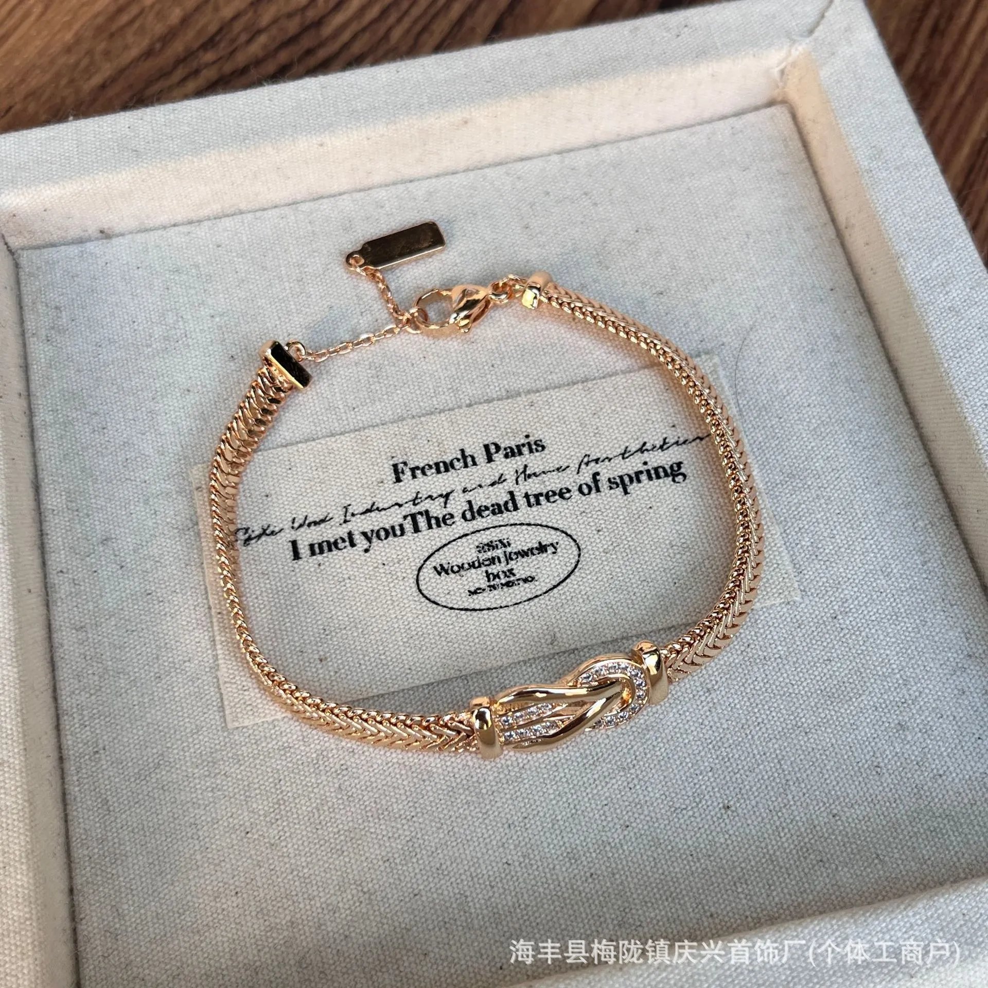 Elegant Gold Plated Bracelet with Crystal Knot Design