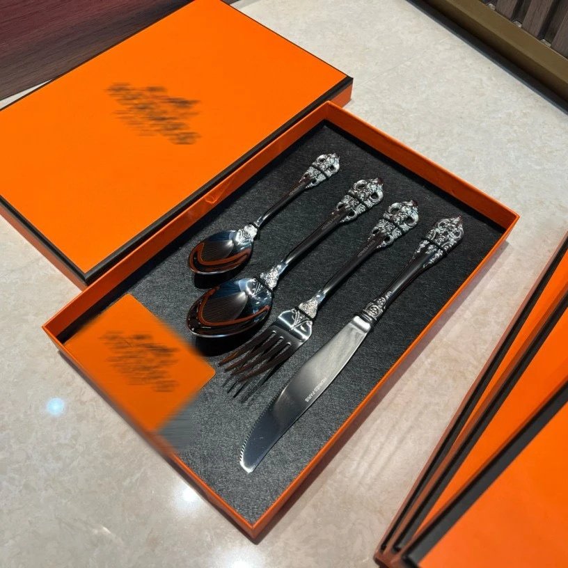 Hermès Silver Cutlery Set with Ornate Handles