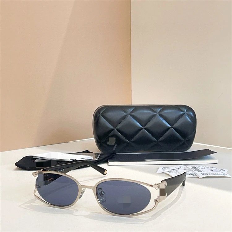 Chanel Oval Sunglasses Chic Eyewear Black and Silver