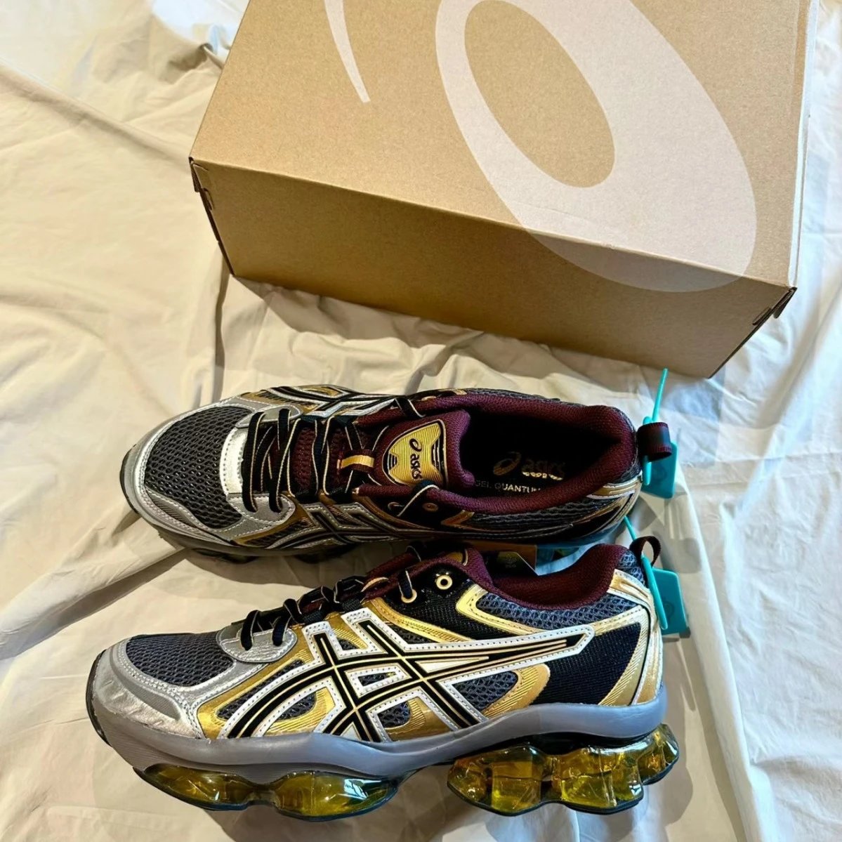 Asics Gel-Quantum Kinetic chunky running sneakers black gold and silver